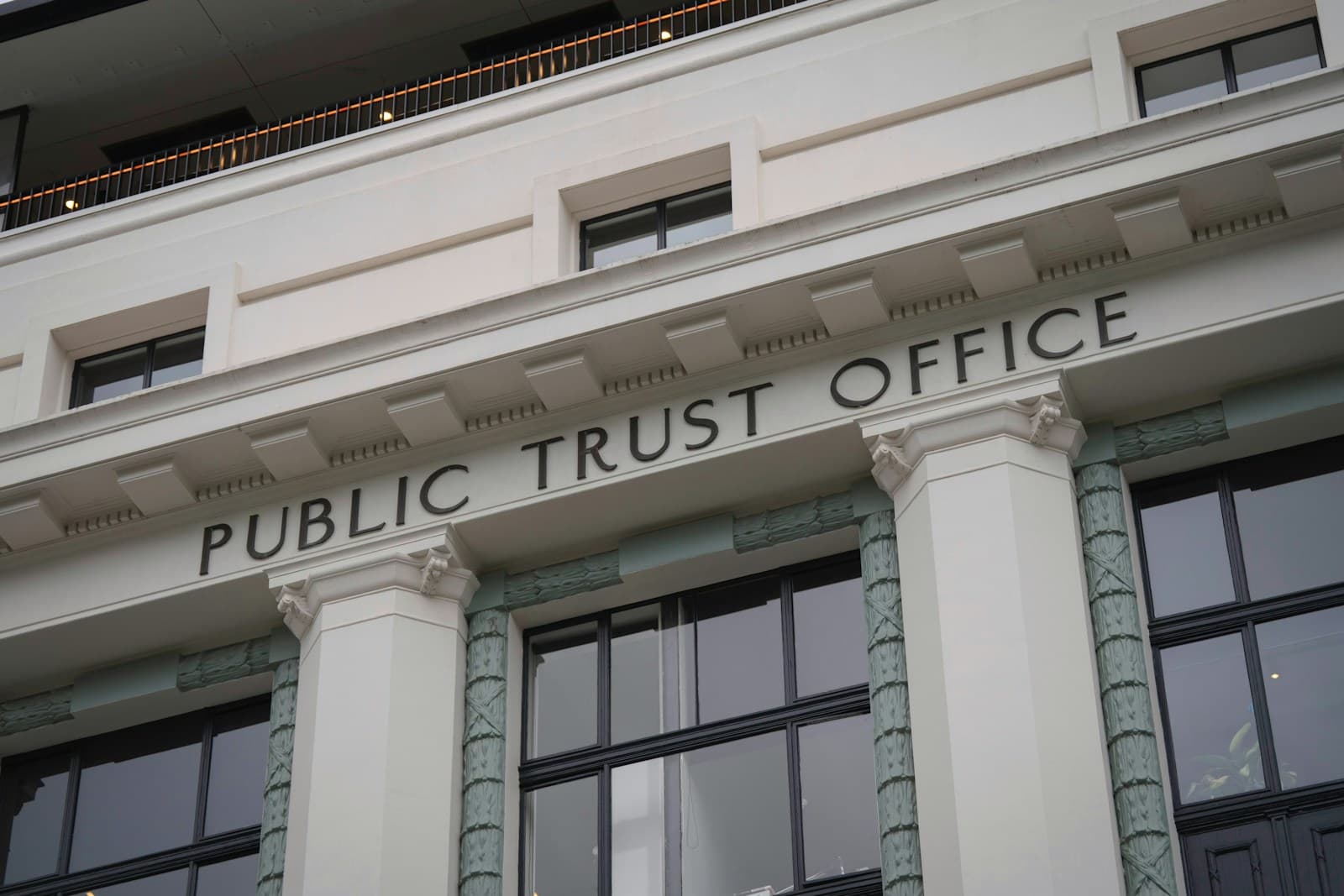 The columned stone facade of a public office building